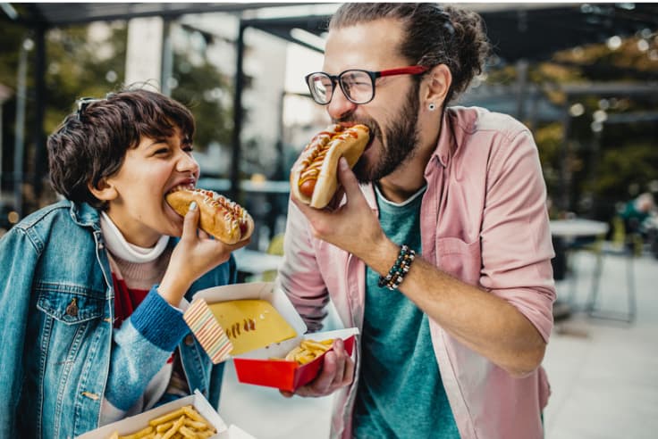 man-child-eating-hotdog